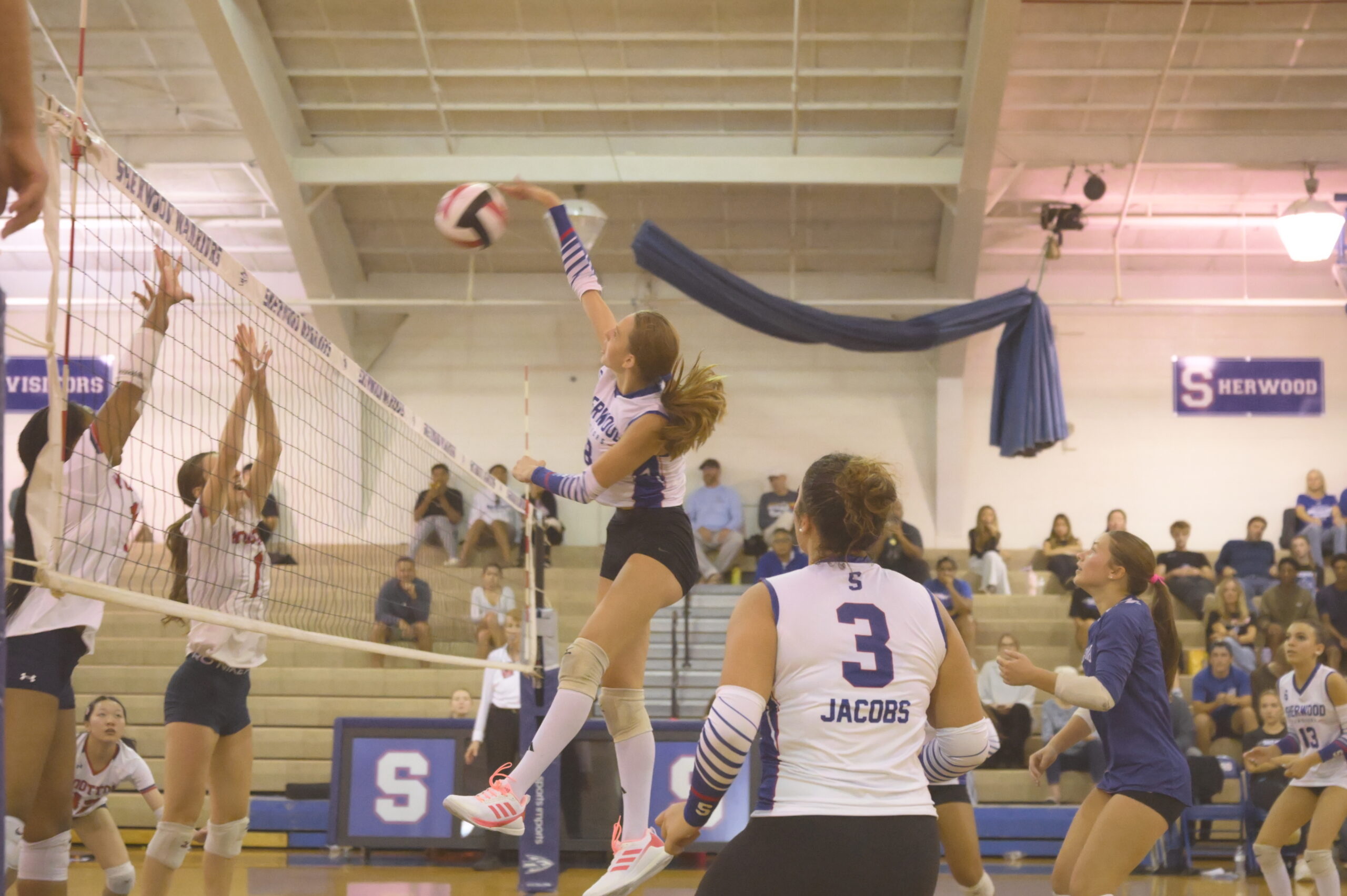Middle Johanne Steppling kills the ball in a close set versus an undefeated Wootton.